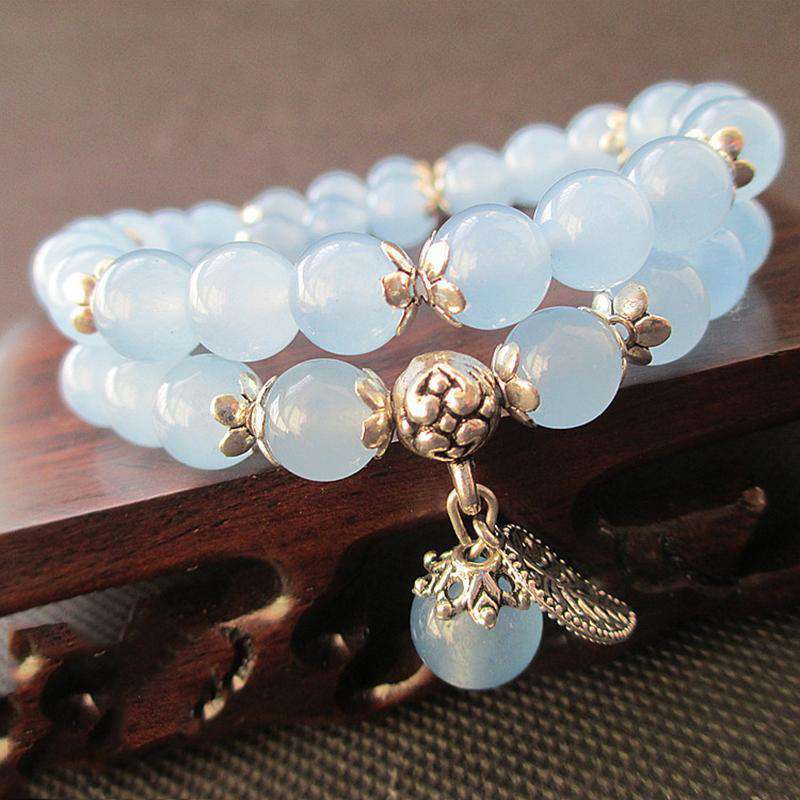 Bracelet Tibétain en perles de Jade bleu avec Pendentif en feuille d'Argent - L'univers-karma